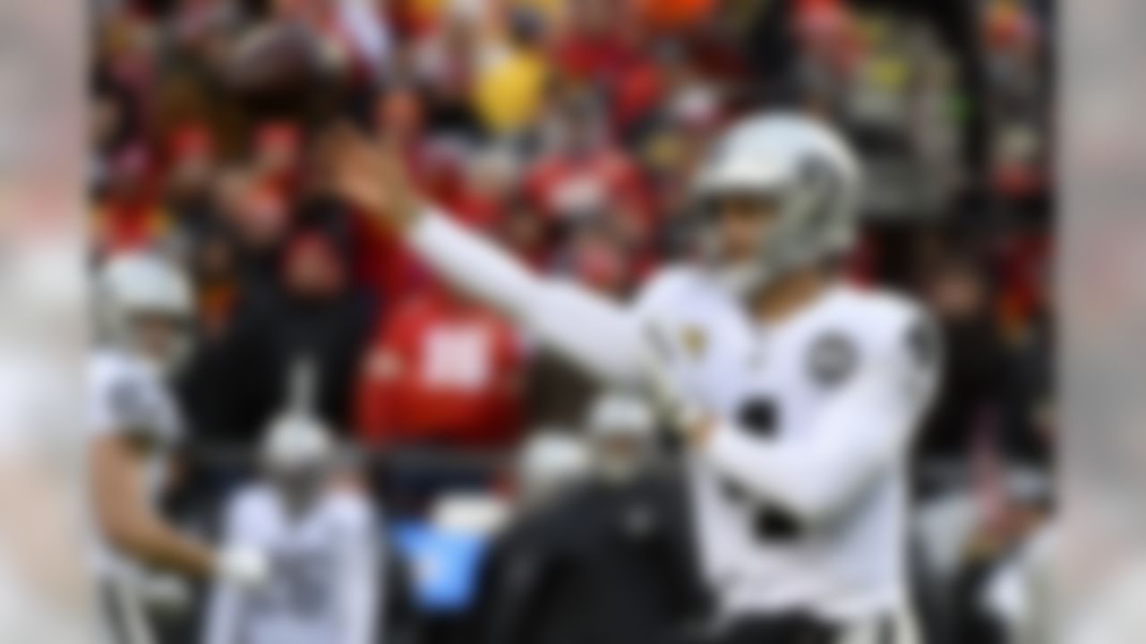 Oakland Raiders quarterback Derek Carr (4) throws a pass during the first half of an NFL football game against the Kansas City Chiefs in Kansas City, Mo., Sunday, Dec. 1, 2019. (AP Photo/Ed Zurga)