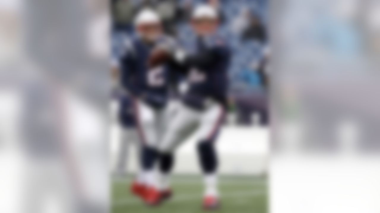 New England Patriots quarterback Tom Brady, right, warms up beside backup quarterback Brian Hoyer before an NFL football game against the Buffalo Bills, Sunday, Dec. 24, 2017, in Foxborough, Mass. (AP Photo/Charles Krupa)