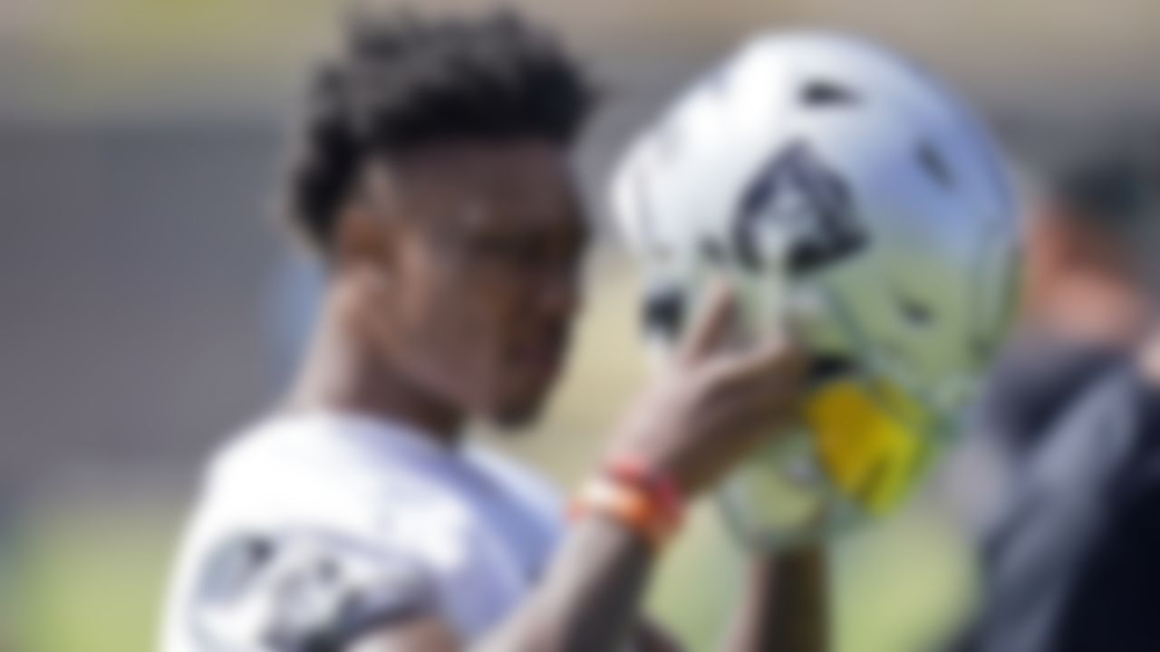 Las Vegas Raiders wide receiver Henry Ruggs III (11) puts on his helmet during NFL football practice, Wednesday, June 2, 2021, in Henderson, Nev.