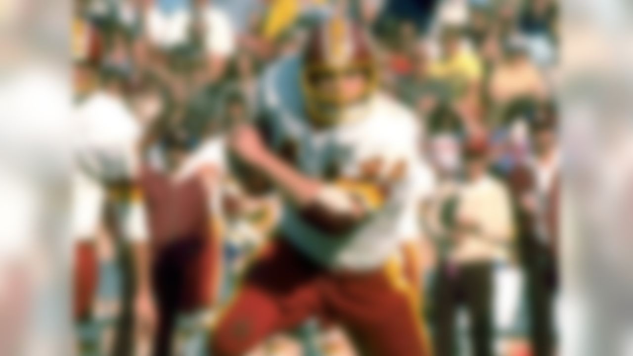 Riggins rushed for 1,000-plus yards in both 1978 and 1979, but he decided to sit out the entire 1980 season. He didn't return until 1981, after new Redskins coach Joe Gibbs convinced him to make a comeback to the gridiron. Upon his return, Riggins played in just 23 combined games and failed to rush for more than 750 yards in the following two seasons. In fact, he wouldn't reach the 1,000-yard rushing mark again until the 1983 campaign.  (AP Photo/NFL Photos)