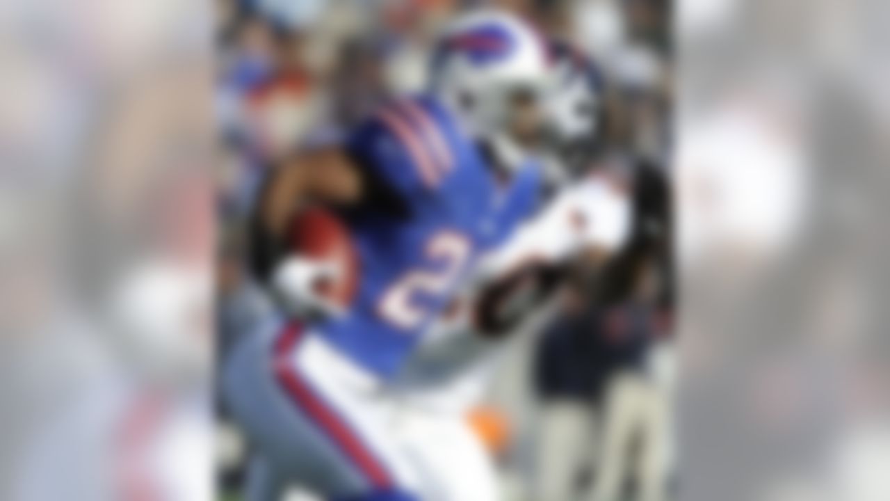 Buffalo Bills' C.J. Spiller (28) runs the ball against Denver Broncos' Brian Dawkins (20) during the first half of an NFL football game in Orchard Park, N.Y., Saturday, Dec. 24, 2011. (AP Photo/Gary Wiepert)