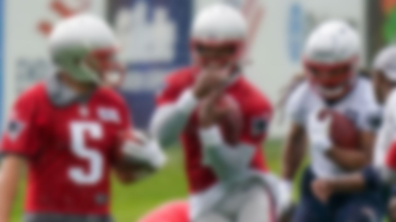 New England Patriots quarterbacks Brian Hoyer (5) and Cam Newton (1) and tight end Jakob Johnson, right, perform field drills on Monday, June 14, 2021, in Foxborough, Mass.