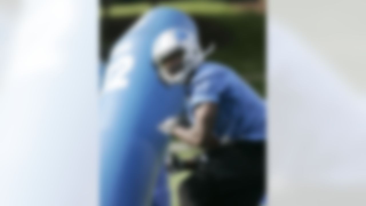 Detroit Lions wide receiver Jarett Dillard (12) hits a tackling dummy during their NFL football training camp Monday, Aug 13, 2012, in Allen Park, Mich. (AP Photo/Duane Burleson)