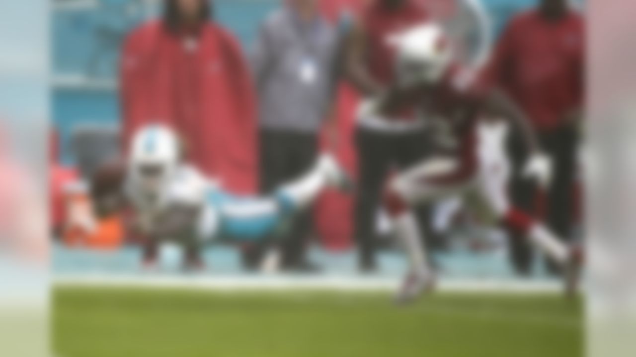 Miami Dolphins running back Jay Ajayi (23) attempts to make a catch as Arizona Cardinals strong safety Tony Jefferson (22) is late with the tackle, during heavy rain in the first half of an NFL football game, Sunday, Dec. 11, 2016, in Miami Gardens, Fla. (AP Photo/Wilfredo Lee)