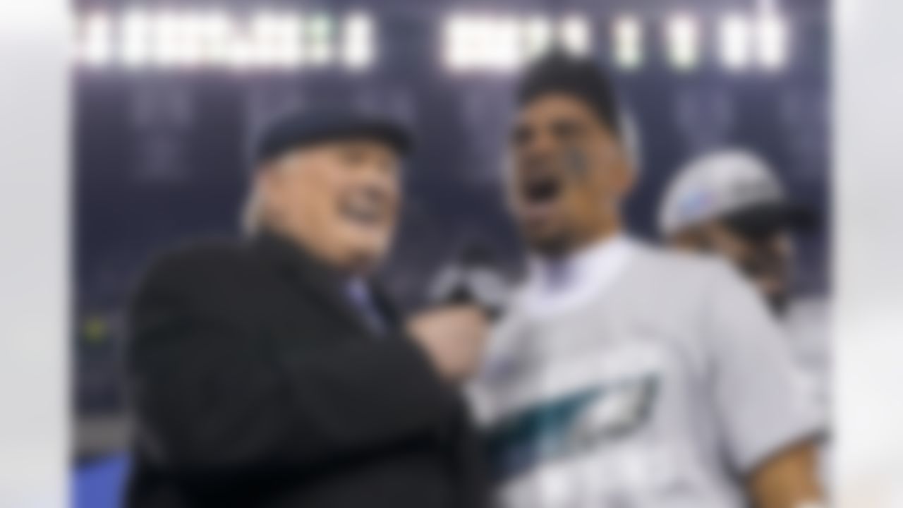 Philadelphia Eagles quarterback Jalen Hurts, center, reacts while speaking toTerry Bradshaw, left, after the NFC Championship NFL football game between the Philadelphia Eagles and the San Francisco 49ers on Sunday, Jan. 29, 2023, in Philadelphia. The Eagles won 31-7.