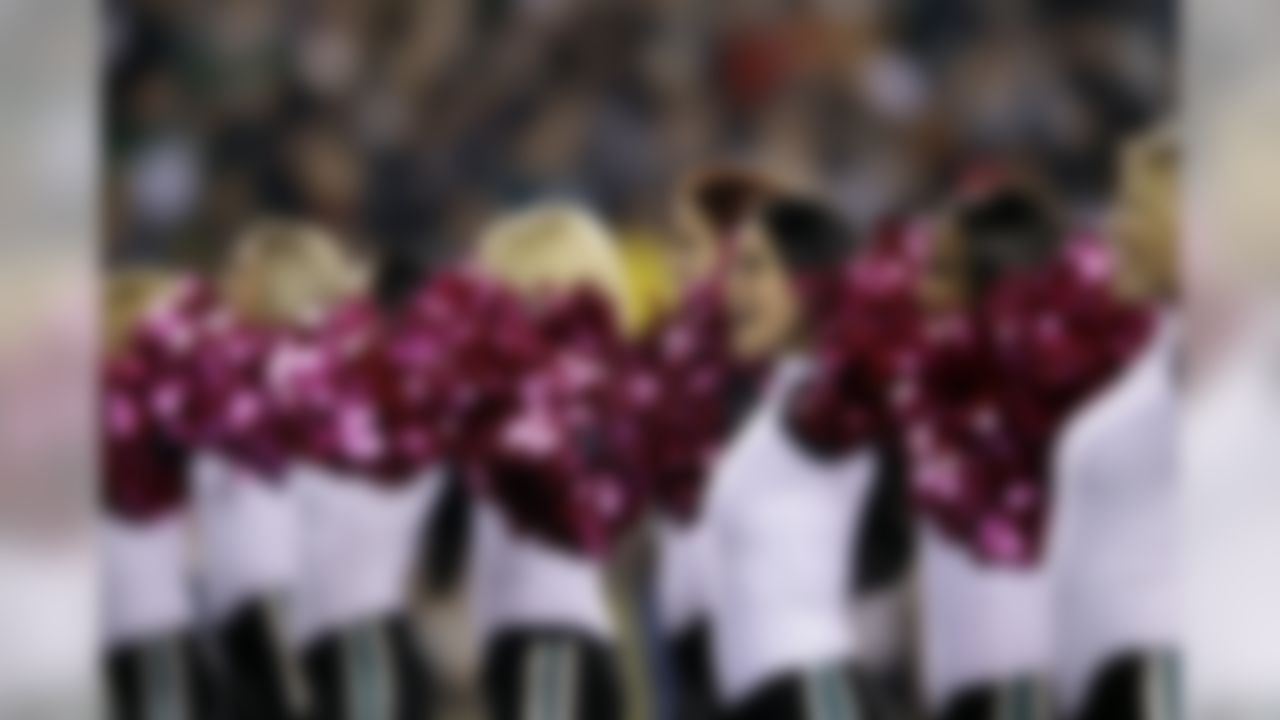 The Philadelphia Eagles cheerleaders perform with pink pom poms in the first half an NFL football game with the Dallas Cowboys Sunday, Oct. 30, 2011 in Philadelphia. (AP Photo/Matt Slocum)