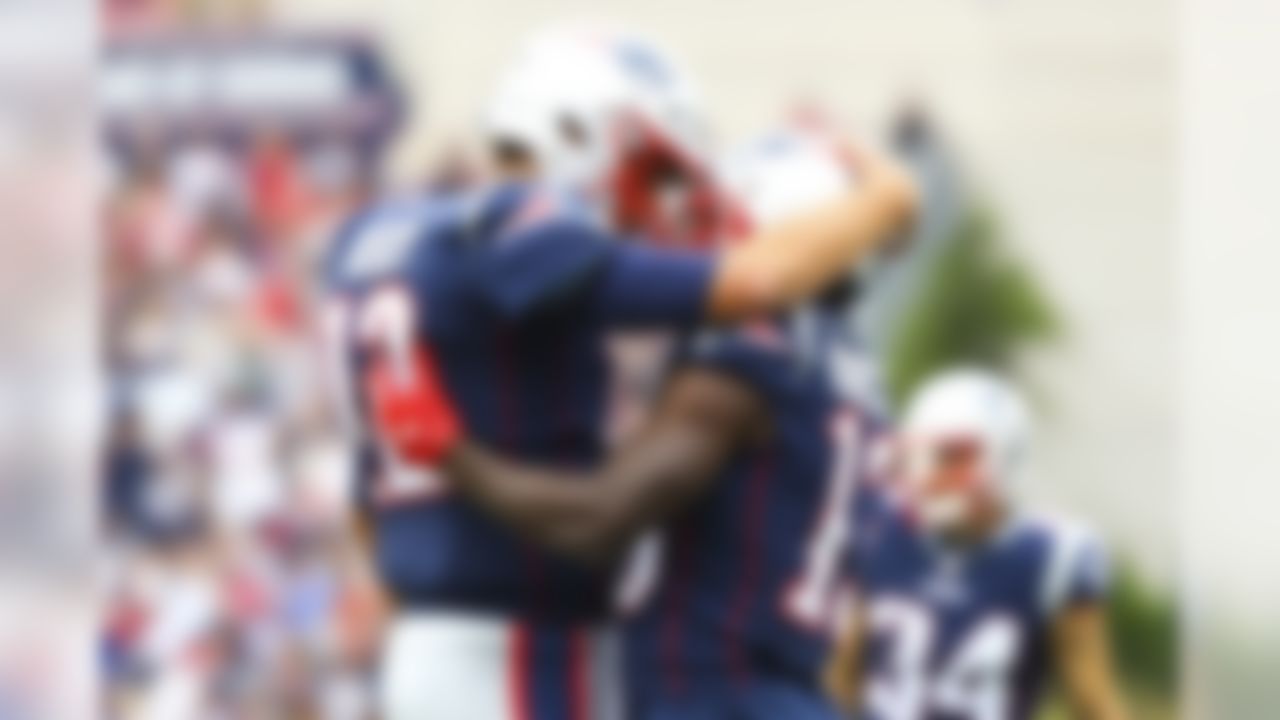 New England Patriots quarterback Tom Brady (12) and wide receiver Phillip Dorsett (13) celebrate after a touchdown during a game against Houston Texans, Sunday, Sept. 9th, 2018 in Foxborough, Mass.  (Logan Bowles / NFL)