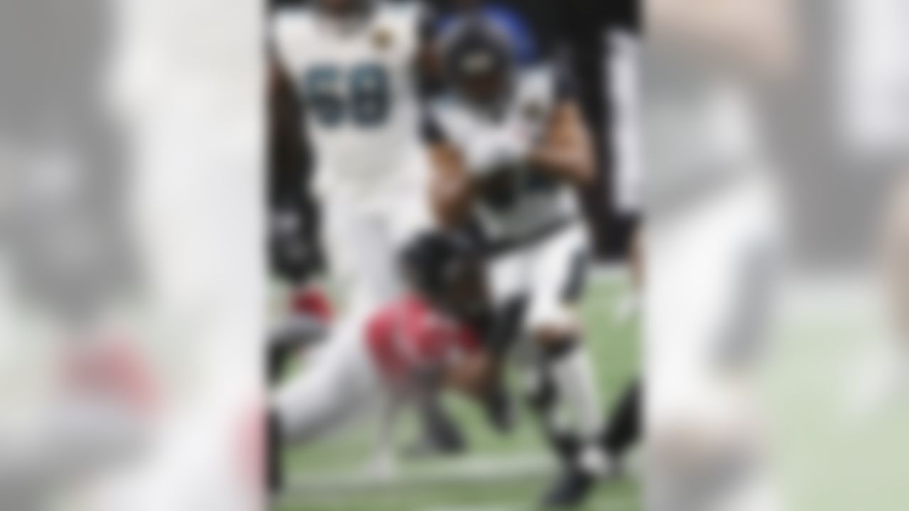 Jacksonville Jaguars' Jonathan Grimes runs against Atlanta Falcons outside linebacker Duke Riley (42) during the first half of an NFL football game, Thursday, Aug. 31, 2017, in Atlanta. (AP Photo/John Bazemore)