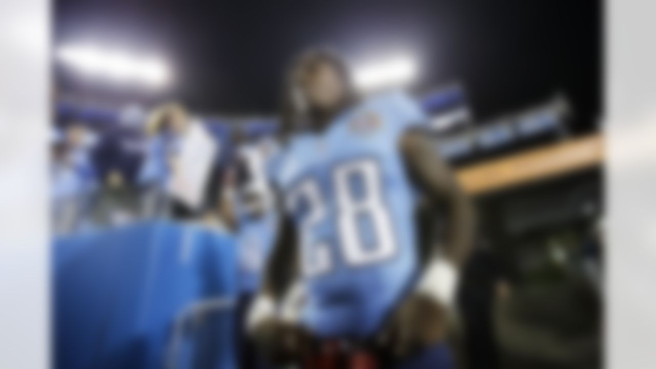 Tennessee Titans running back Chris Johnson (28) walks on to the field before an NFL football game between the Titans and the New York Jets on Tuesday, Dec. 18, 2012, in Nashville, Tenn. (AP Photo/Joe Howell)
