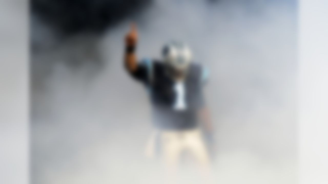 Carolina Panthers quarterback Cam Newton gestures as he is introduced before an NFL football game against the Tampa Bay Buccaneers in Charlotte, N.C., Saturday, Dec. 24, 2011. (AP Photo/Mike McCarn)