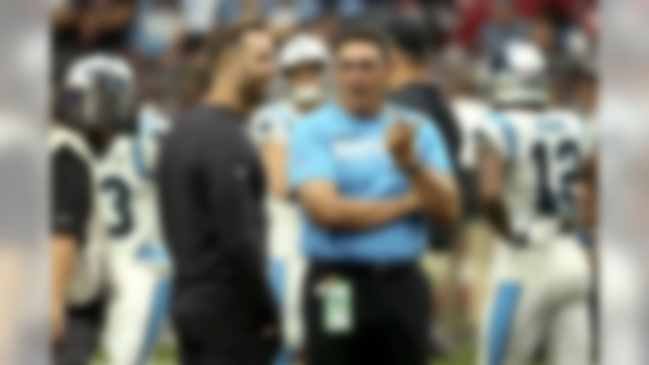 Carolina Panthers head coach Ron Rivera, right, talks with Arizona Cardinals head coach Kliff Kingsbury prior to an NFL football game, Sunday, Sept. 22, 2019, in Glendale, Ariz. (AP Photo/Ross D. Franklin)