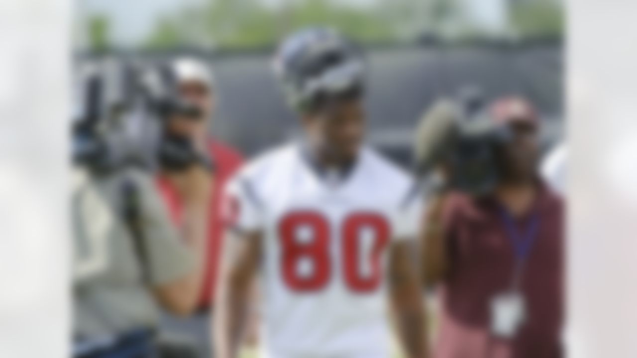 Houston Texans receiver Andre Johnson arrives at an NFL football mini camp, Thursday, May 20, 2010, in Houston. Johnson is in a contract dispute with the Texans and missed the opening three voluntary practices. (AP Photo/Dave Einsel)