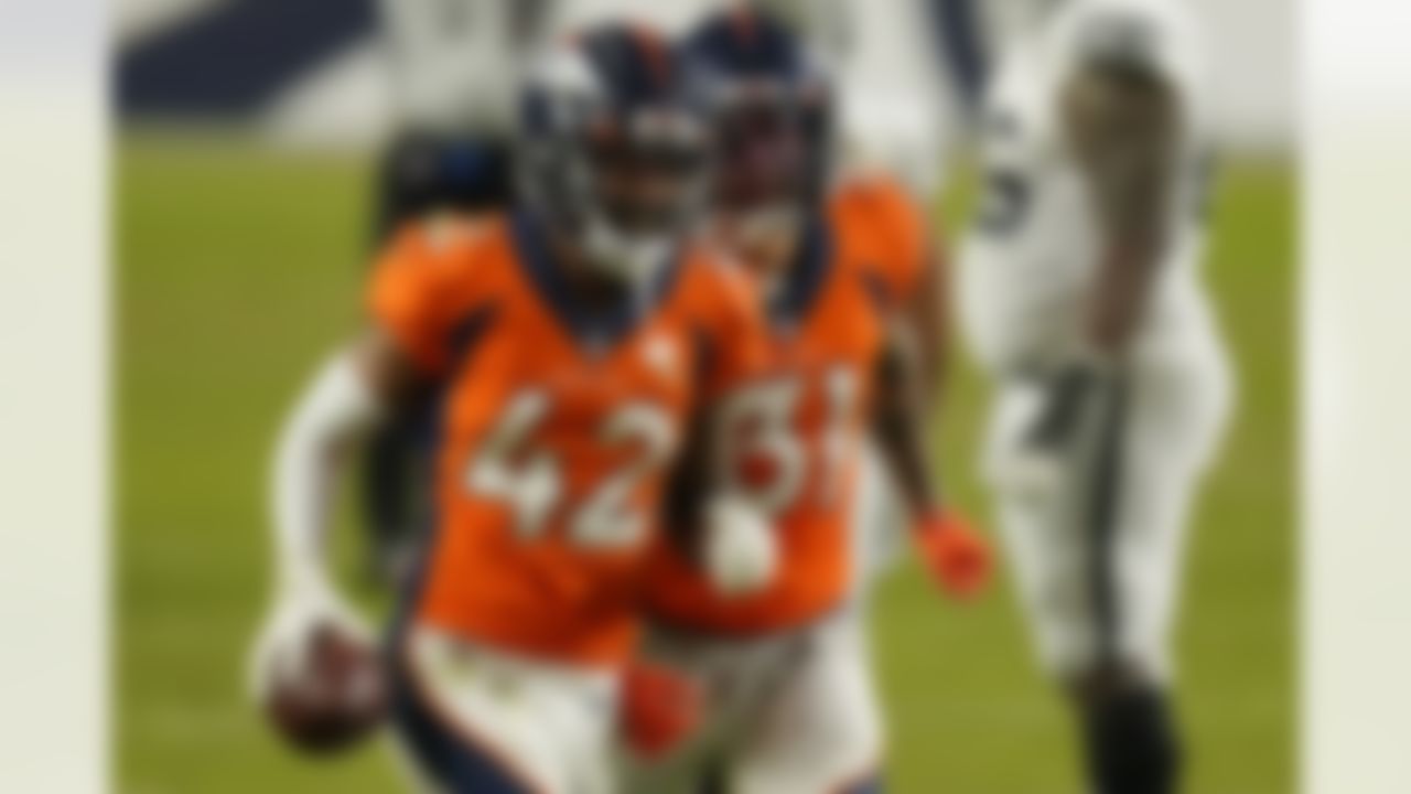 Denver Broncos free safety Justin Simmons (31) and cornerback Parnell Motley (42) celebrate after Motley recovered a fumble by the Las Vegas Raiders during the second half of an NFL football game, Sunday, Jan. 3, 2021, in Denver.