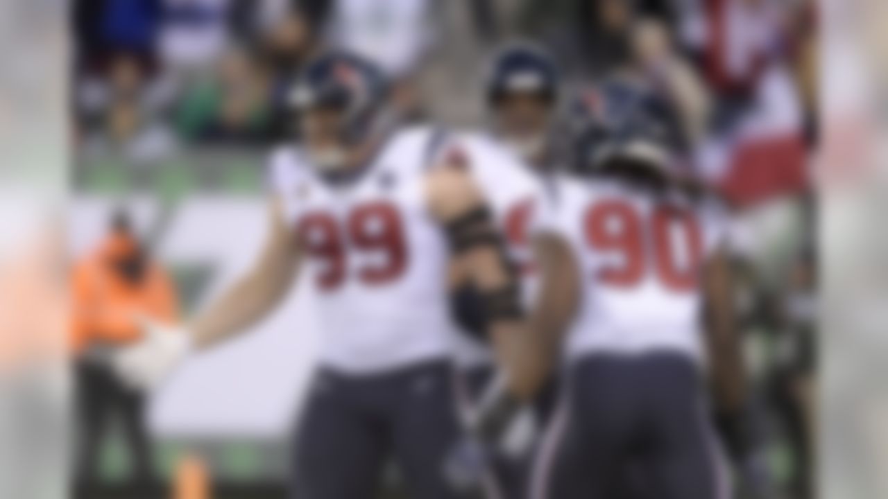 Houston Texans defensive end J.J. Watt (99) celebrates with teammates after sacking New York Jets quarterback Sam Darnold, not pictured, during the first half of an NFL football game, Saturday, Dec. 15, 2018, in East Rutherford, N.J. (AP Photo/Bill Kostroun)