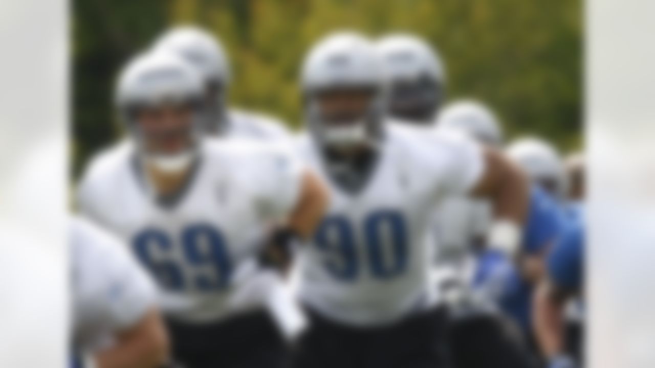 Detroit Lions defensive tackle Ndamukong Suh (90) and safety Sam Scroggins (69) run through drills during rookie football mini-camp at the team's practice facility in Allen Park, Mich, Friday, April 30, 2010. Suh says he has to start off at "ground zero" because being the No. 2 pick in the NFL draft is no longer relevant. Lions coach Jim Schwartz says Suh got his message Friday during the first of a three-day rookie orientation camp. (AP Photo/Carlos Osorio)
