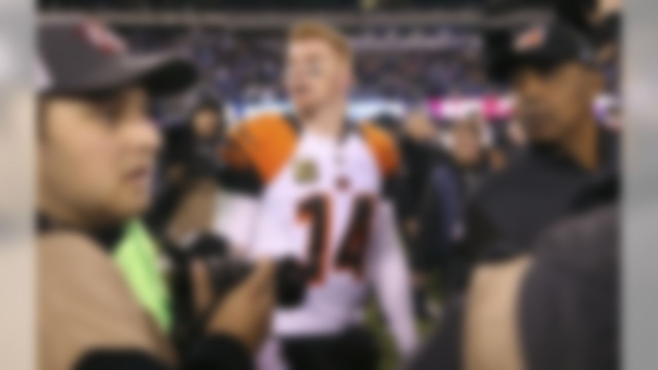 Cincinnati Bengals quarterback Andy Dalton (14) walks off the field after playing in an NFL football game against the New York Giants , Monday, Nov. 14, 2016, in East Rutherford, N.J. The Giants won 21-20. (AP Photo/Seth Wenig)