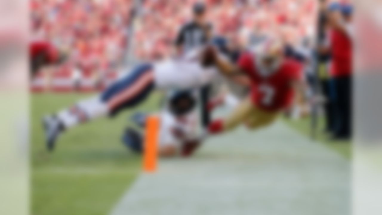 San Francisco 49ers quarterback Colin Kaepernick (7) reaches for the pylon during the NFL regular season game against the Chicago Bears on Sunday, Sept. 14, 2014 at the Levi's Stadium in Santa Clara, Calif. (Ric Tapia/NFL)