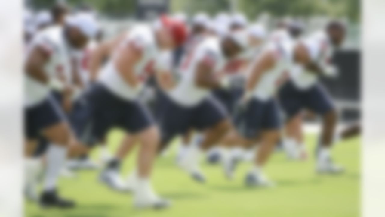 Houston Texans' offensive linemen warm up during an NFL football mini camp, Wednesday, May 19, 2010, in Houston. (AP Photo/Dave Einsel)