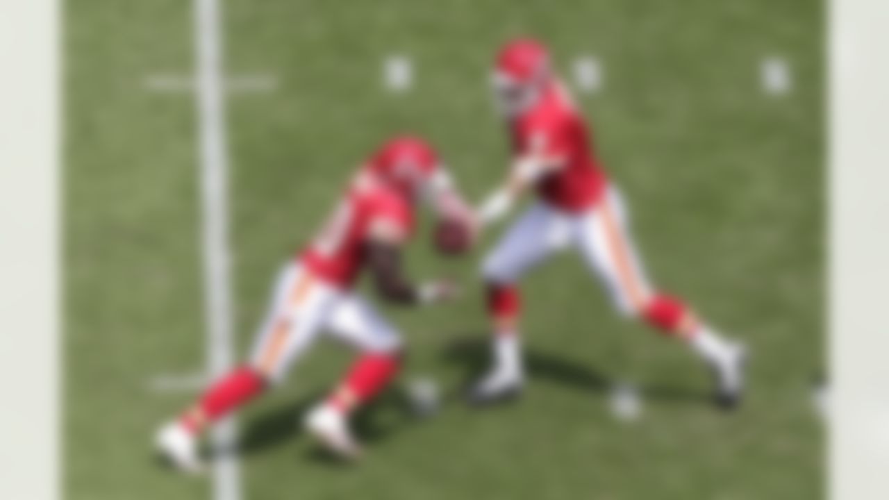 Kansas City Chiefs quarterback Matt Cassel hands off to Thomas Jones in the first half of an NFL football game against the San Diego Chargers Sunday, Sept. 25, 2011, in San Diego. (AP Photo/Gregory Bull)