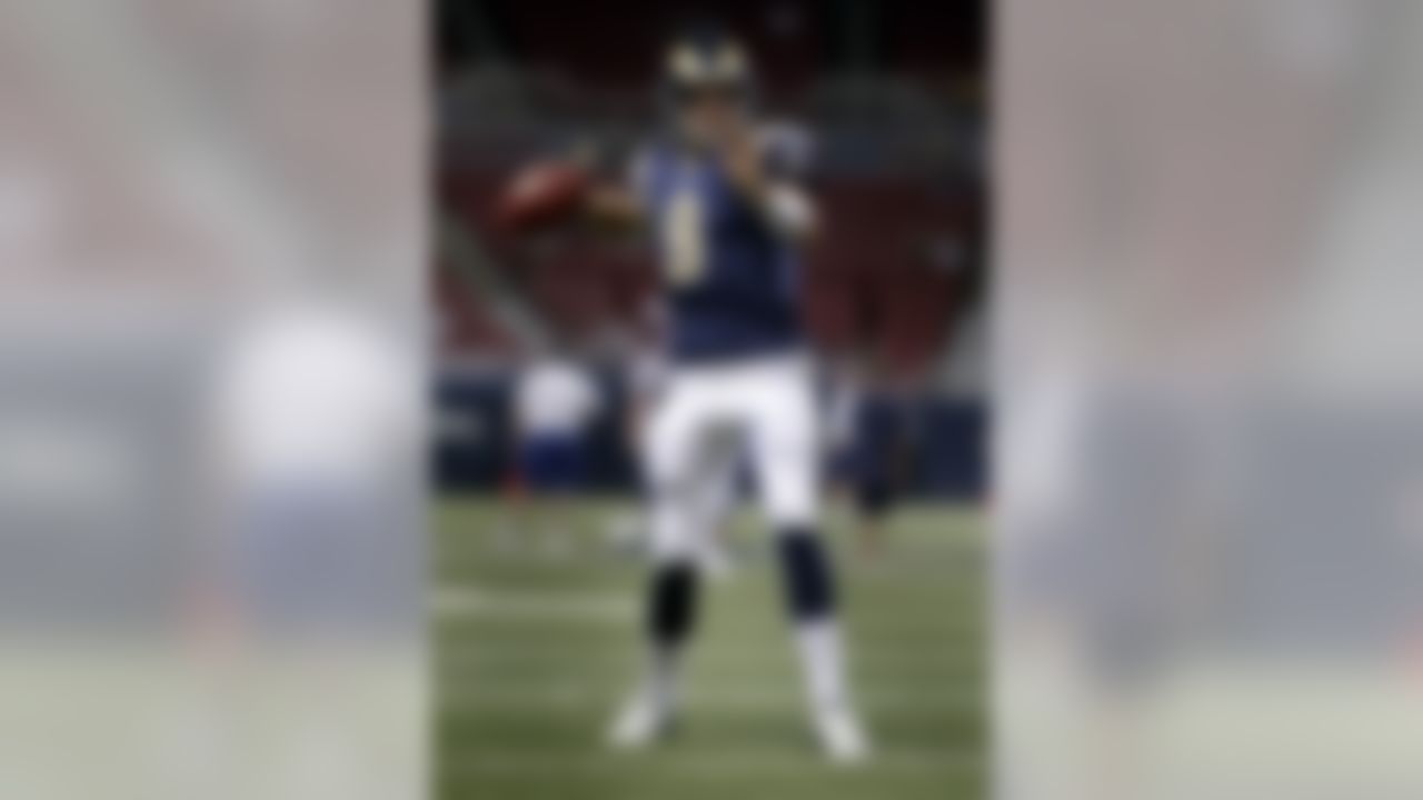 St. Louis Rams starting quarterback Sam Bradford (8) hands the