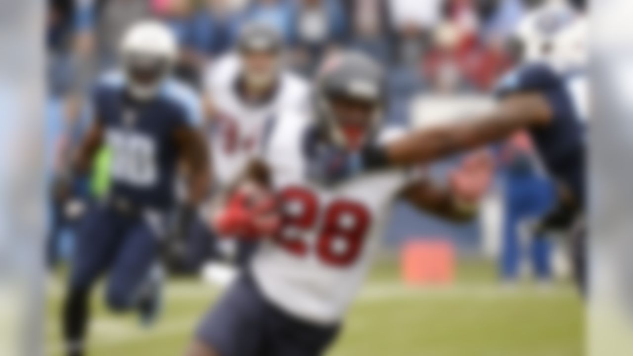 Houston Texans running back Alfred Blue (28) runs the ball against the Tennessee Titans in the first half of an NFL football game Sunday, Jan. 1, 2017, in Nashville, Tenn. (AP Photo/Mark Zaleski)