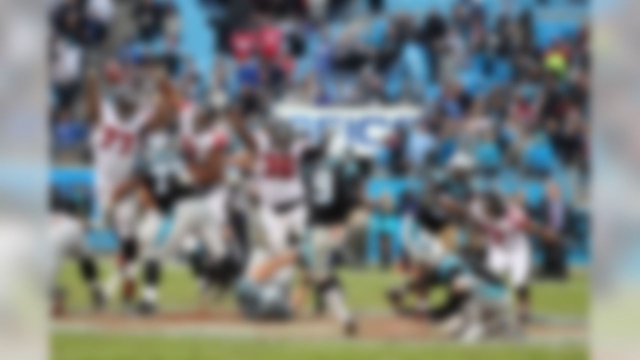 Carolina Panthers kicker Graham Gano (9) kick is blocked by Atlanta Falcons defensive end Ra'Shede Hageman (77) during an NFL football game at Bank of America Stadium on Sunday, November 16, 2014, in Charlotte. The Falcons defeated the Panthers 19-17. (Perry Knotts/NFL)