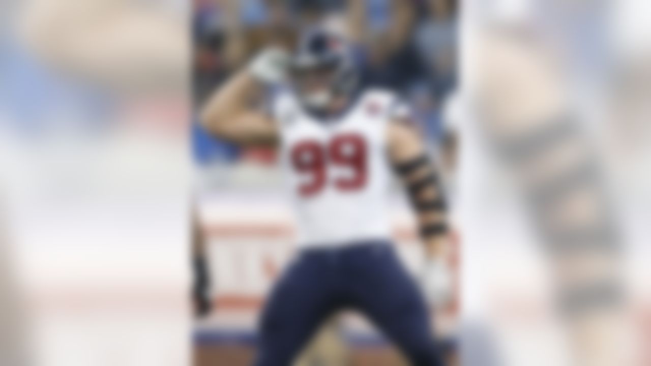 Houston Texans defensive end J.J. Watt (99) celebrates a sack of Detroit Lions quarterback Matthew Stafford, not pictured, in the fourth quarter of an NFL football game at Ford Field in Detroit, Thursday, Nov. 22, 2012. Houston defeated Detroit 34-31 in overtime. (AP Photo/Rick Osentoski)