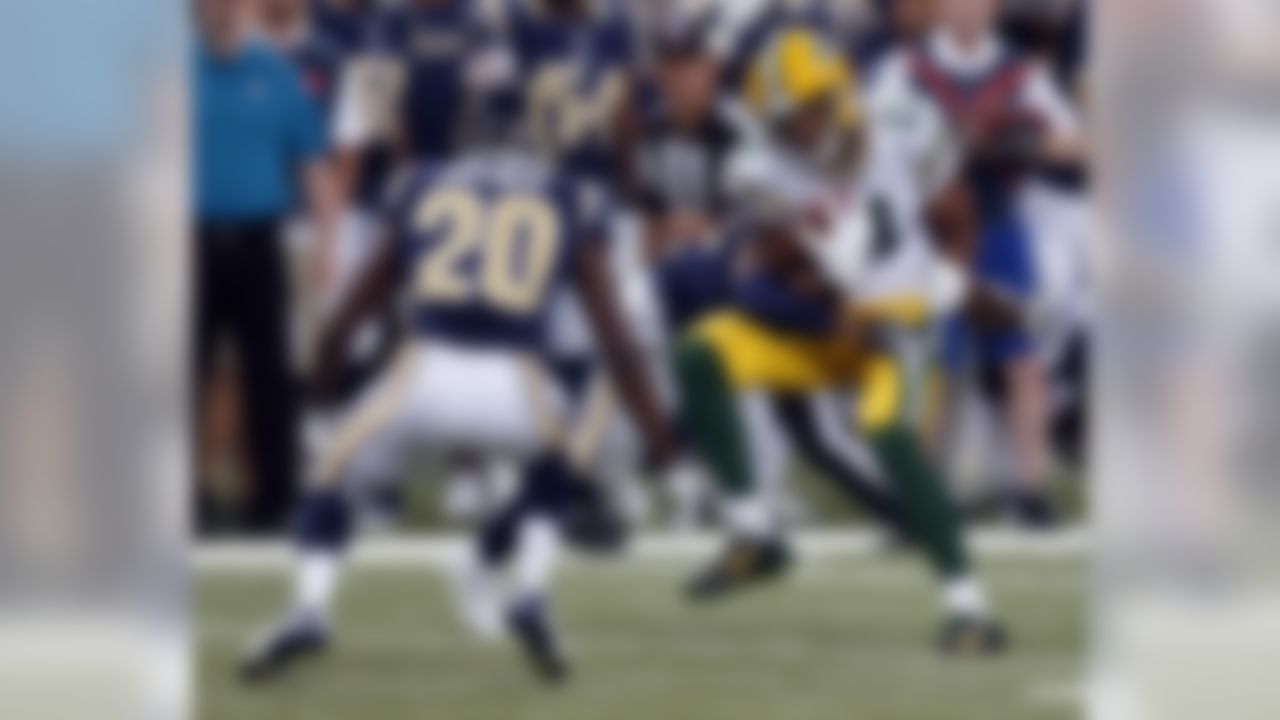 Green Bay Packers wide receiver Jarrett Boykin, right, catches a pass for a 7-yard gain as St. Louis Rams cornerback Lamarcus Joyner (20) defends during the first quarter of an NFL preseason football game Saturday, Aug. 16, 2014, in St. Louis. (AP Photo/Scott Kane)