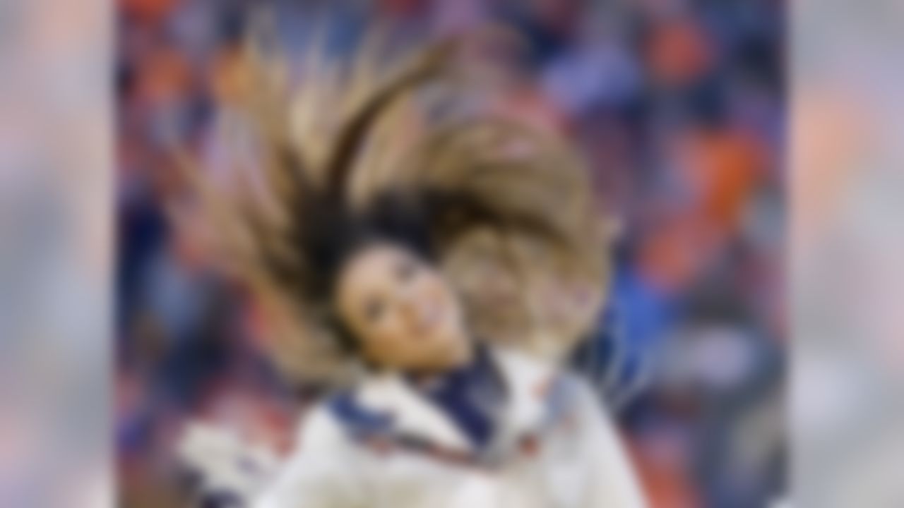 A Denver Broncos cheerleader performs  during the first half in an NFL football divisional playoff game against the Pittsburgh Steelers, Sunday, Jan. 17, 2016, in Denver. (AP Photo/Joe Mahoney)