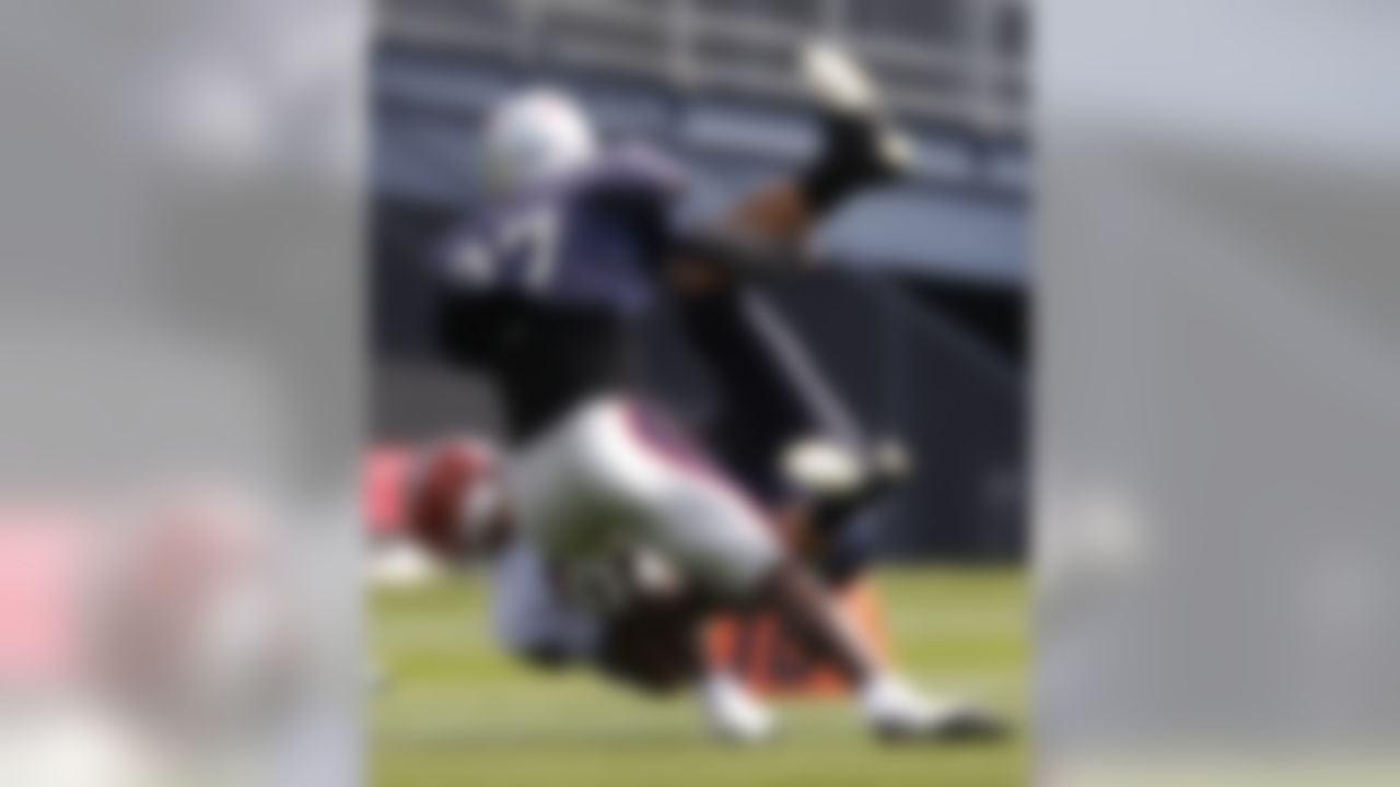 New England Patriots' Aaron Hernandez, bottom, is taken down  by Kyle Arrington after catching a pass  during a scrimmage at NFL football training camp, Monday, Aug. 2, 2010, in Foxborough, Mass. (AP Photo/Michael Dwyer)