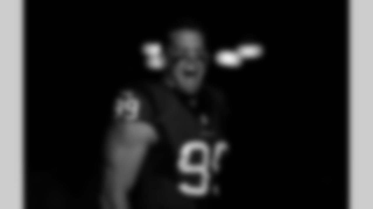 In this photo, altered with an Instagram filter, Houston Texans defensive end J.J. Watt (99) celebrates as he enters the field during player introductions prior to an NFL football game against the New England Patriots on Sunday, Dec. 13, 2015, in Houston. New England won 27-6. (Aaron M. Sprecher via AP)