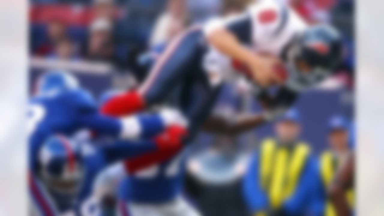 EAST RUTHERFORD, NJ - NOVEMBER 05:  Quarterback David Carr #8 of the Houston Texans dives into the endzone for a touchdown against the New York Giants on November 5, 2006 at Giants Stadium in East Rutherford, New Jersey. The Giants defeated the Texans 14-10. Photo by Getty Images.