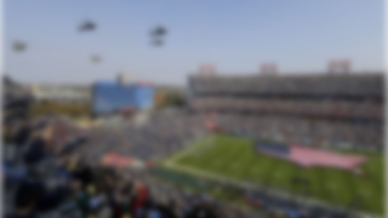 Helicopters fly over Nissan Stadium during the Salute to Service pregame activities before an NFL football game between the Tennessee Titans and the Green Bay Packers Sunday, Nov. 13, 2016, in Nashville, Tenn. (AP Photo/James Kenney)