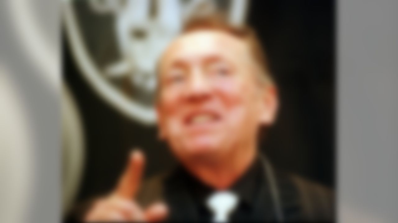Oakland Raiders owner Al Davis smiles during a press conference at the team's Alameda, Calif., practice facility Tuesday, Jan. 27, 1998. The conference was held to introduce the team's new head coach, Jon Gruden. (AP Photo/Dan Krauss)