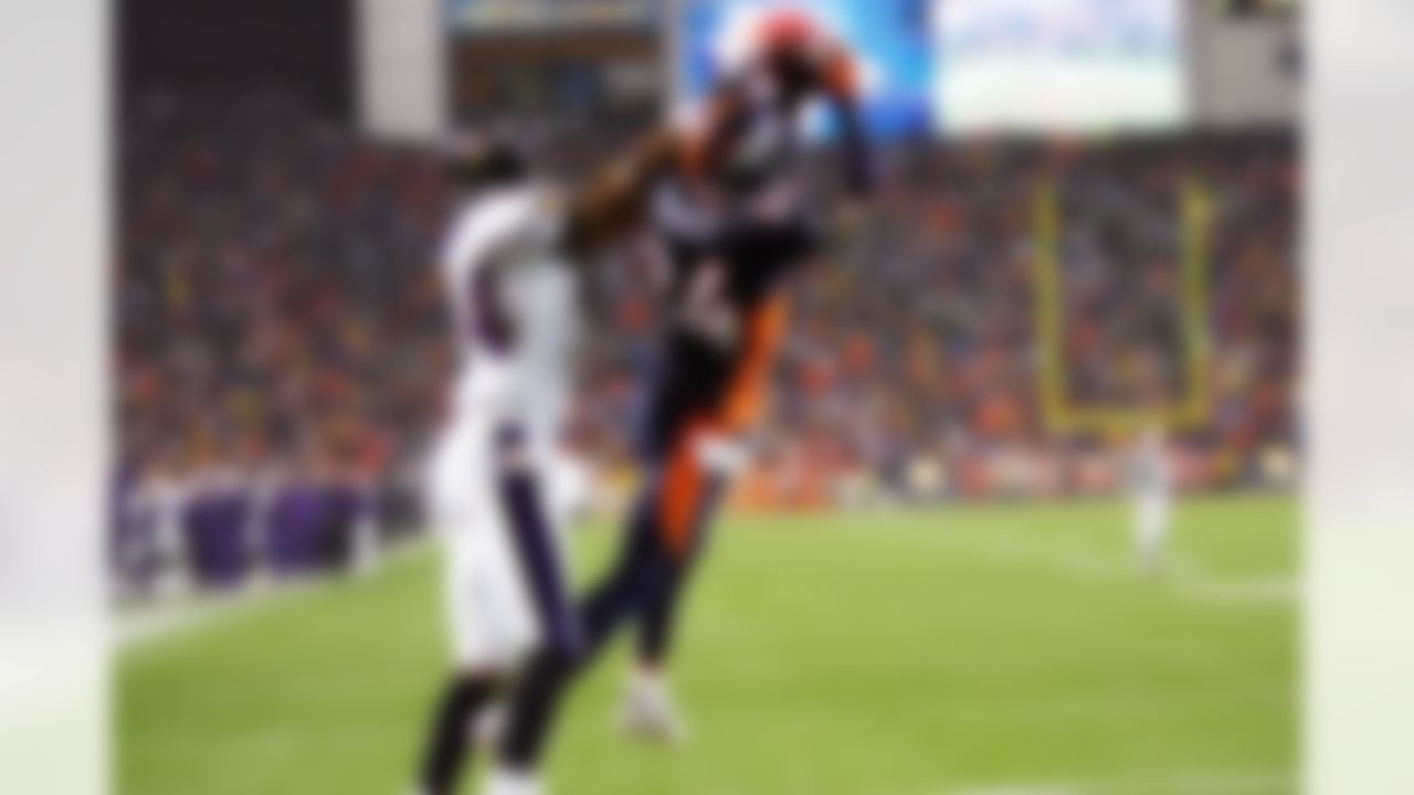 Safety Champ Bailey #24 of the Denver Broncos intercepts an end zone pass intended for wide receiver Clarence Moore #94 of the Baltimore Ravens at INVESCO Field at Mile High on October 9, 2006 in Denver, Colorado. The Broncos defeated the Ravens 13-3. (AP Photo/Paul Spinelli)