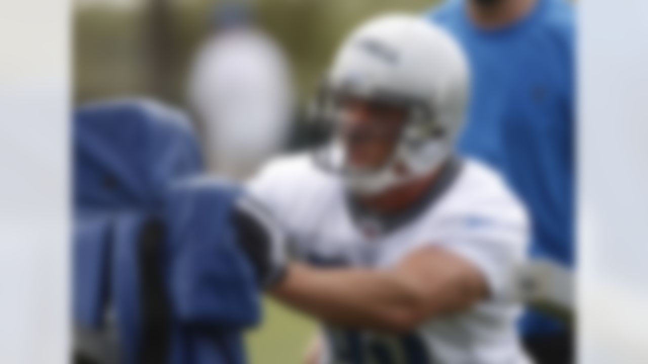 Detroit Lions linebacker Caleb Campbell pushes a tacking dummy during rookie football mini-camp at the team's practice facility in Allen Park, Mich, Friday, April 30, 2010. The Lions got Campbell on the football field two years after they drafted him out of Army. Detroit drafted Campbell in the seventh round of the 2008 NFL draft. On the eve of training camp, he was told not to sign his contract. The U.S. Army revised its interpretation of U.S. Department of Defense policy regarding soldiers playing professional sports, requiring cadets to complete two years of active duty before applying for a release. (AP Photo/Carlos Osorio)
