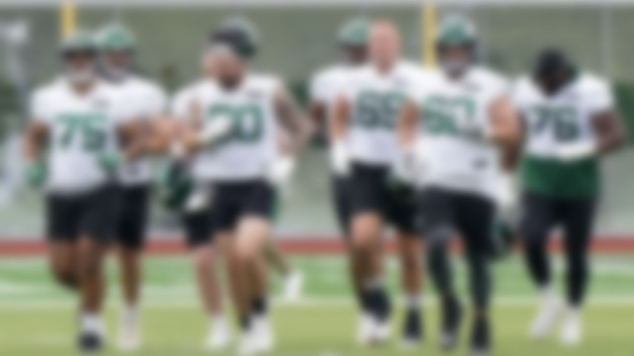 Players head to a practice field for drills during an NFL football practice, Wednesday, June 2, 2021, in Florham Park, N.J. Offensive lineman Alijah Vera-Tucker is at far left.