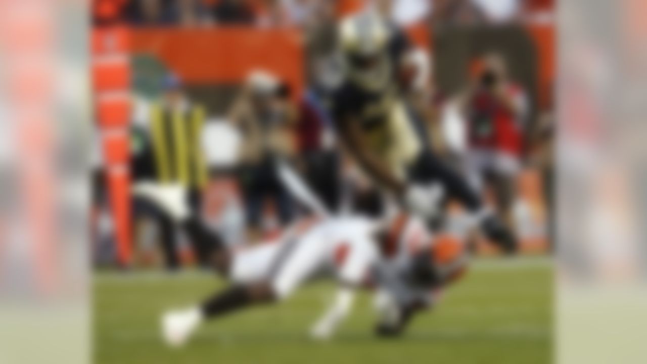 New Orleans Saints wide receiver Michael Thomas (13) jumps over Cleveland Browns strong safety Derrick Kindred (30) during the first half of an NFL preseason football game, Thursday, Aug. 10, 2017, in Cleveland. (AP Photo/Ron Schwane)