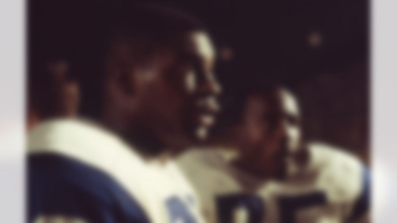 Los Angeles Rams defensive linemen Lamar Lundy (85) and Hall-of-Famer David "Deacon" Jones (75) on the sidlines in undated image. (National Football League)