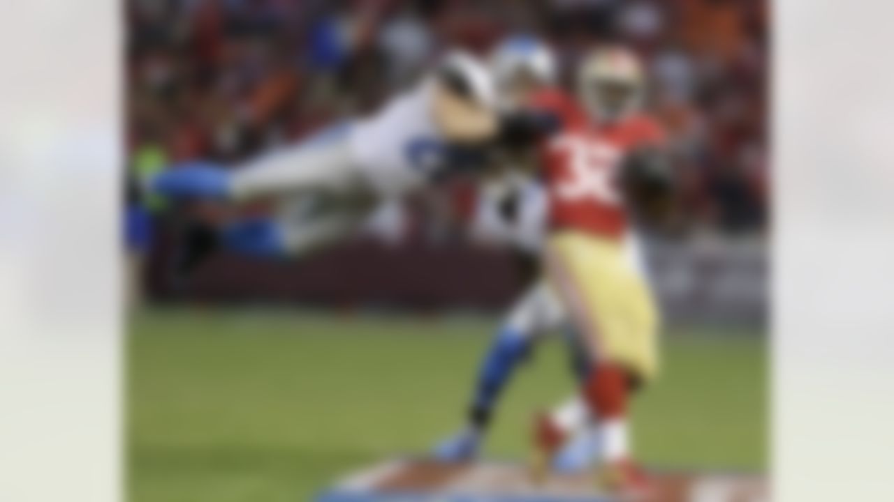 San Francisco 49ers running back Kendall Hunter, right, runs with the ball, but is stopped by Detroit Lions free safety John Wendling, left, during the third quarter of an NFL football game in San Francisco, Sunday, Sept. 16, 2012. (AP Photo/Marcio Jose Sanchez)