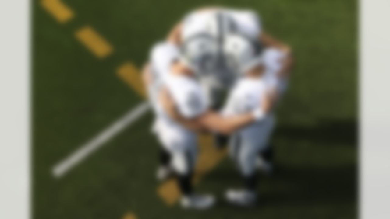 Las Vegas Raiders kicker Daniel Carlson (2), long snapper Trent Sieg (47) and punter A.J. Cole (6) huddle up prior to an NFL football game against the Los Angeles Chargers.