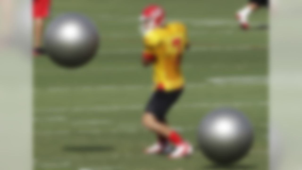 Kansas City Chiefs quarterback Matt Cassel (7) dodges balls during a drill at NFL football training camp in St Joseph, Mo., Thursday, Aug. 4, 2011. (AP Photo/Orlin Wagner)