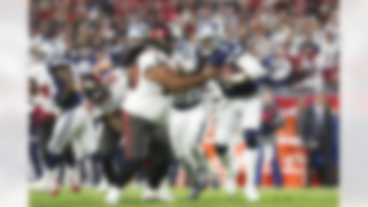 Dallas Cowboys quarterback Dak Prescott (4) gets hit by Tampa Bay Buccaneers defensive tackle Vita Vea (50) during an NFL Super Wild Card Weekend playoff game on Monday, January 16, 2023 in Tampa, Florida.
