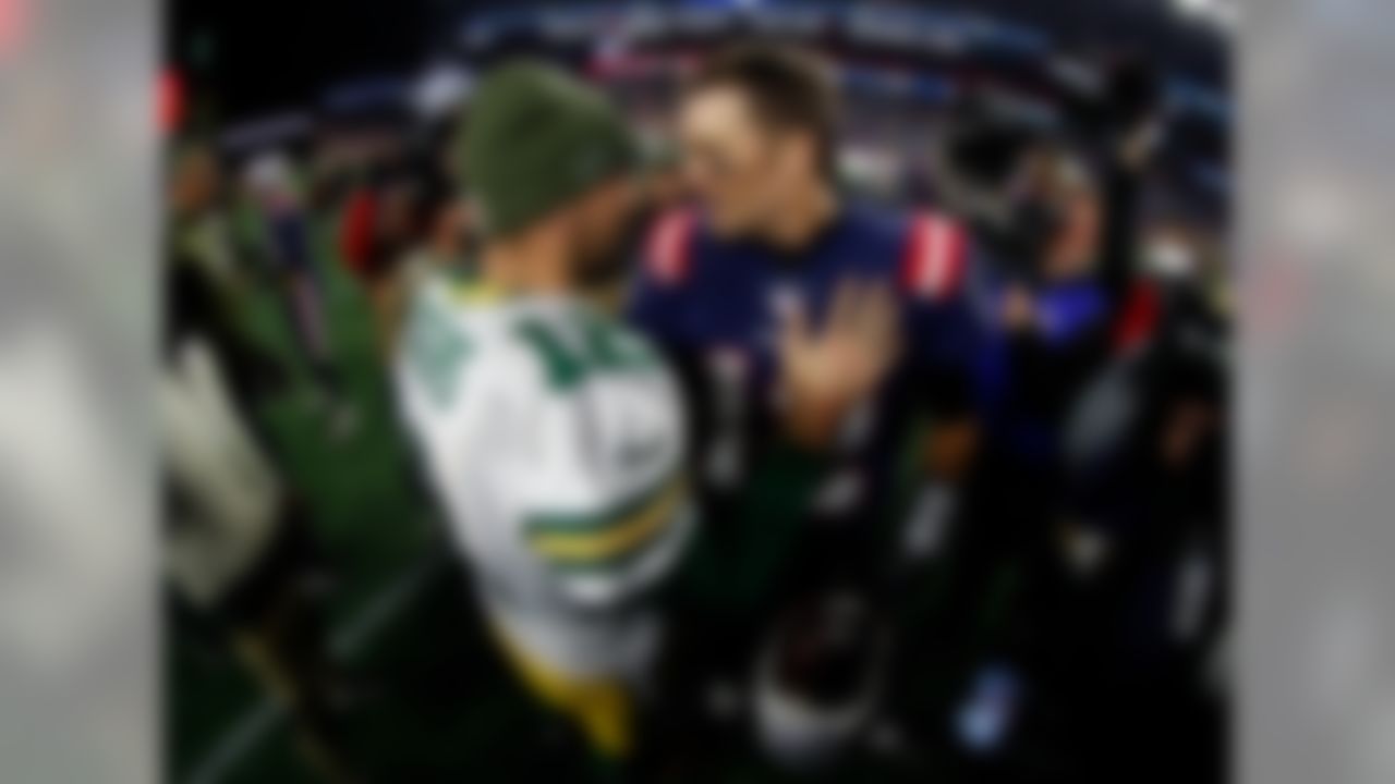 Packers quarterback Aaron Rodgers (left) and Patriots quarterback Tom Brady greet each other following New England's win over Green Bay in Foxborough, Mass. (Ryan Kang/NFL)