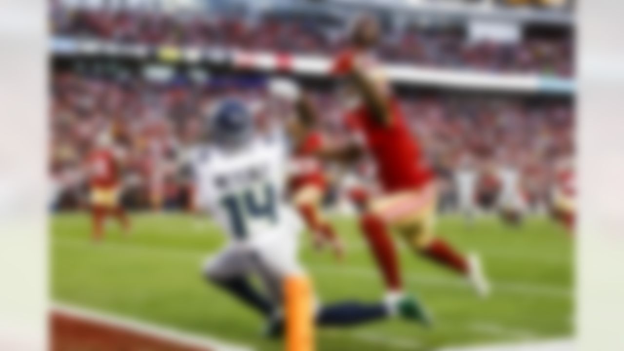 San Francisco 49ers cornerback Jimmie Ward (1) tips the ball as he defends Seattle Seahawks wide receiver DK Metcalf (14) during an NFL Super Wild Card Weekend playoff game on Saturday, January 14, 2023 in Santa Clara, California.