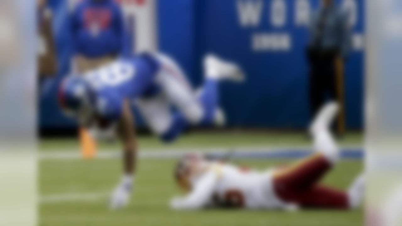 New York Giants tight end Evan Engram (88) is tripped up by Washington Redskins free safety D.J. Swearinger (36) during the first quarter of an NFL football game, Sunday, Oct. 28, 2018, in East Rutherford, N.J. (AP Photo/Seth Wenig)