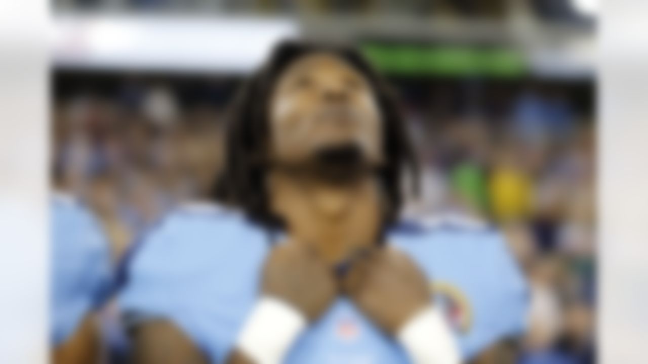Tennessee Titans running back Chris Johnson listens to the National Anthem before an NFL football game between the Titans and the New York Jets on Monday, Dec. 17, 2012, in Nashville, Tenn. (AP Photo/Joe Howell)