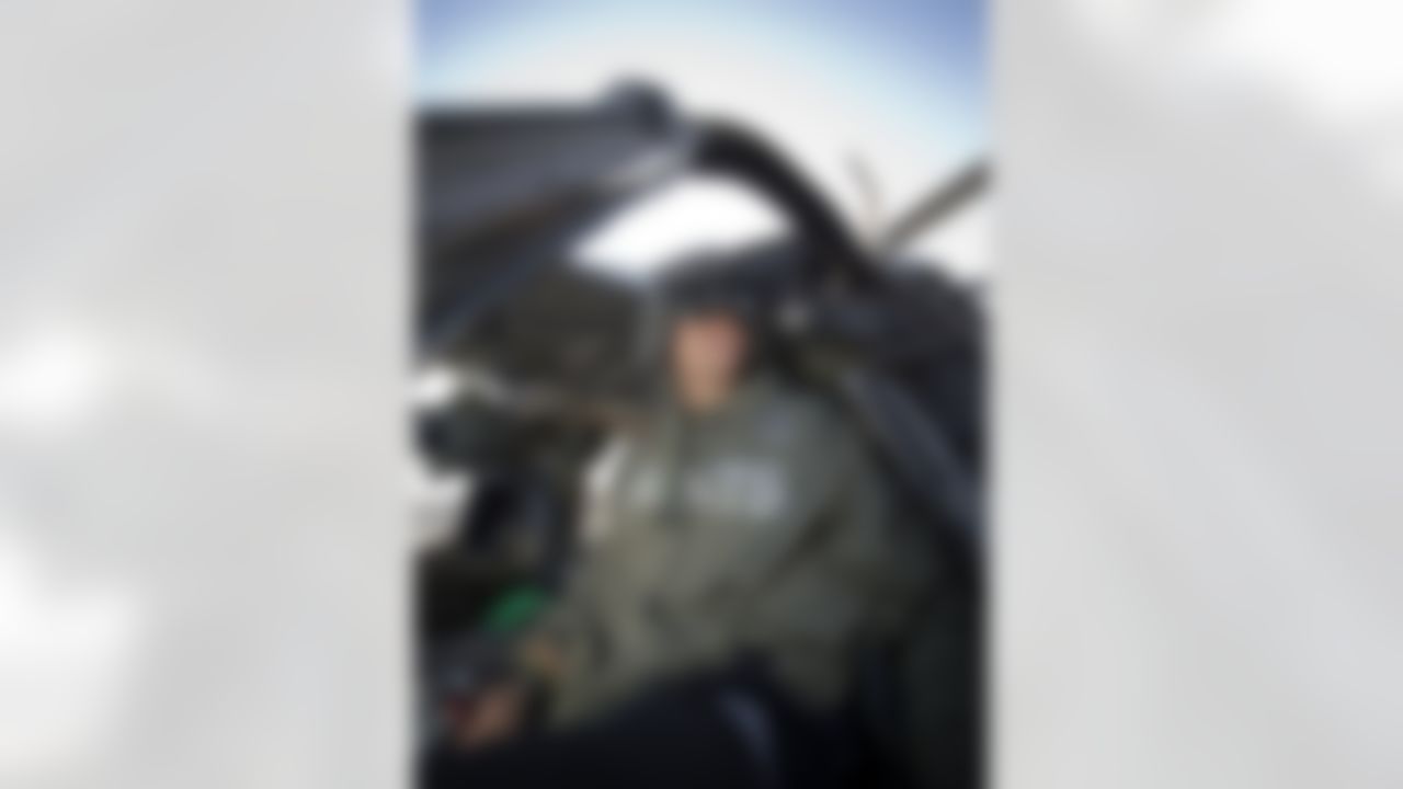 Jimmy Graham of the New Orleans Saints sits in the pilot's seat of a medical rescue Blackhawk helicopter as part of his six-day USO/NFL tour to the Middle East on March 5, 2014. Graham, an avid pilot himself, is in the region with Brandon Fields of the Miami Dolphins and Pierre Garcon of the Washington Redskins to help the USO make �Every Moment Count� with troops. (USO Photo by Dave Gatley)