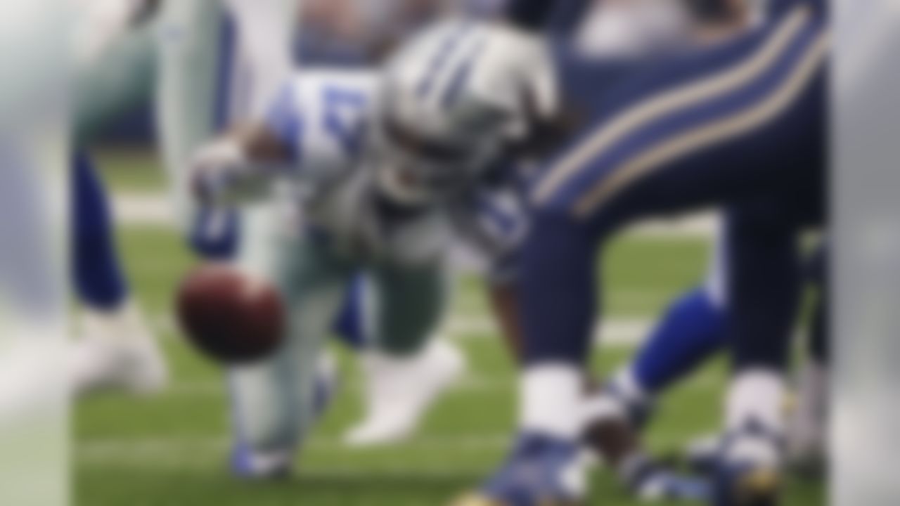 Dallas Cowboys wide receiver Dwayne Harris (17) fumbles a punt return against the St. Louis Rams during the first quarter of a NFL football game Sunday, Sept. 22, 2013, in Arlington, Texas. (AP Photo/Tony Gutierrez)