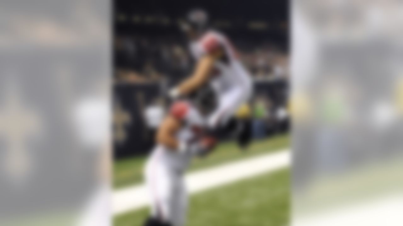 Atlanta Falcons guard Mike Johnson (79) celebrates his touchdown with tight end Tony Gonzalez (88) in the first half an NFL football game against the New Orleans Saints at the Mercedes-Benz Superdome in New Orleans, Sunday, Nov. 11, 2012. (AP Photo/Bill Feig)